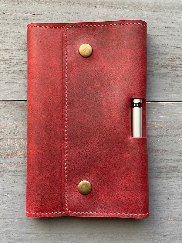 red notebook cover closed red notebook cover closed