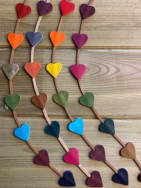 Coloured leather hearts on a leather lace